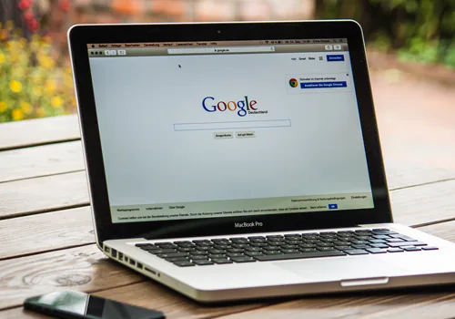 photo of laptop with google loaded in browser
