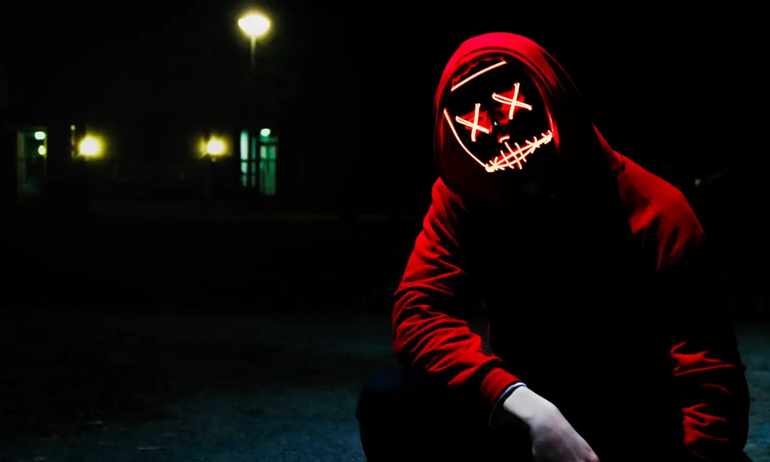 photo of mystery man with mask in red hoodie